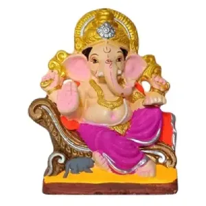 Statue of the Hindu god Ganesha with an elephant head, seated, wearing a gold crown and pink garments.